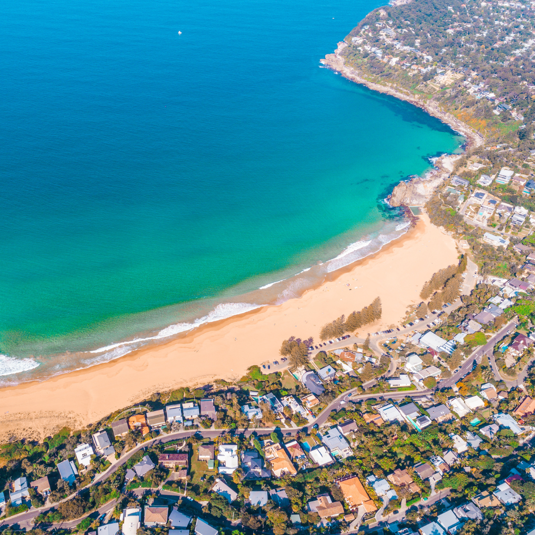 20 Aerial view straight down over Palm Beach homes, beach, and streets – a Palm Beach property buyer’s dream