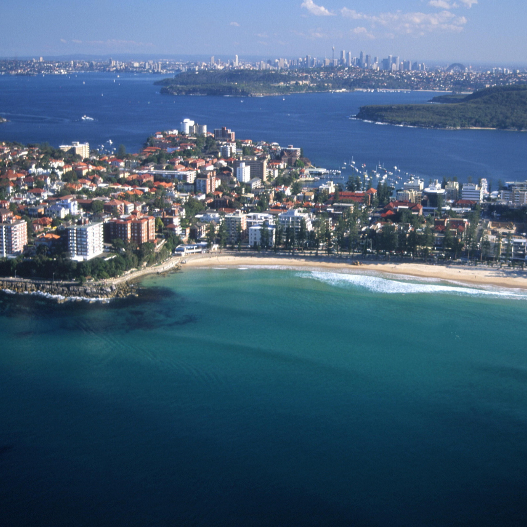 3 Eastern aerial of Manly showing surf, homes, and beaches – key view for any Manly buyers agent.