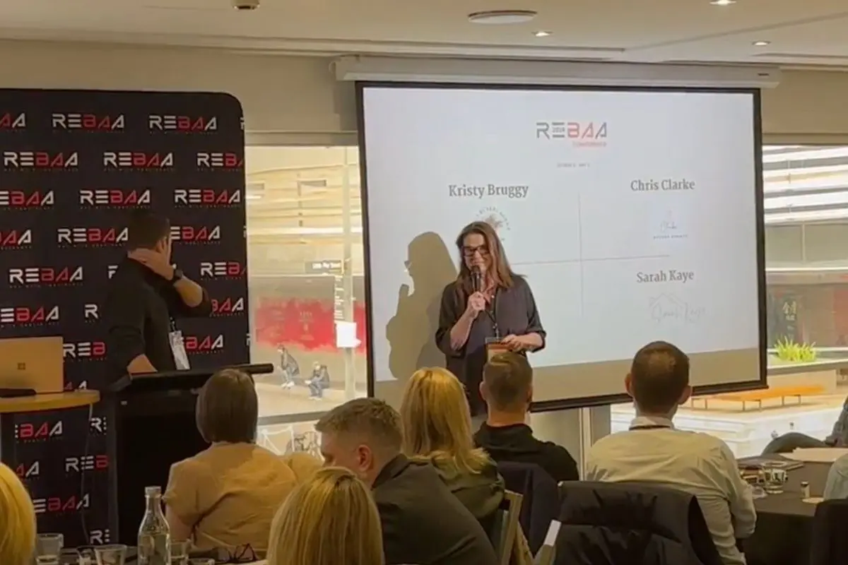 Sarah Kaye presenting at a real estate event as a Northern Beaches property expert.
