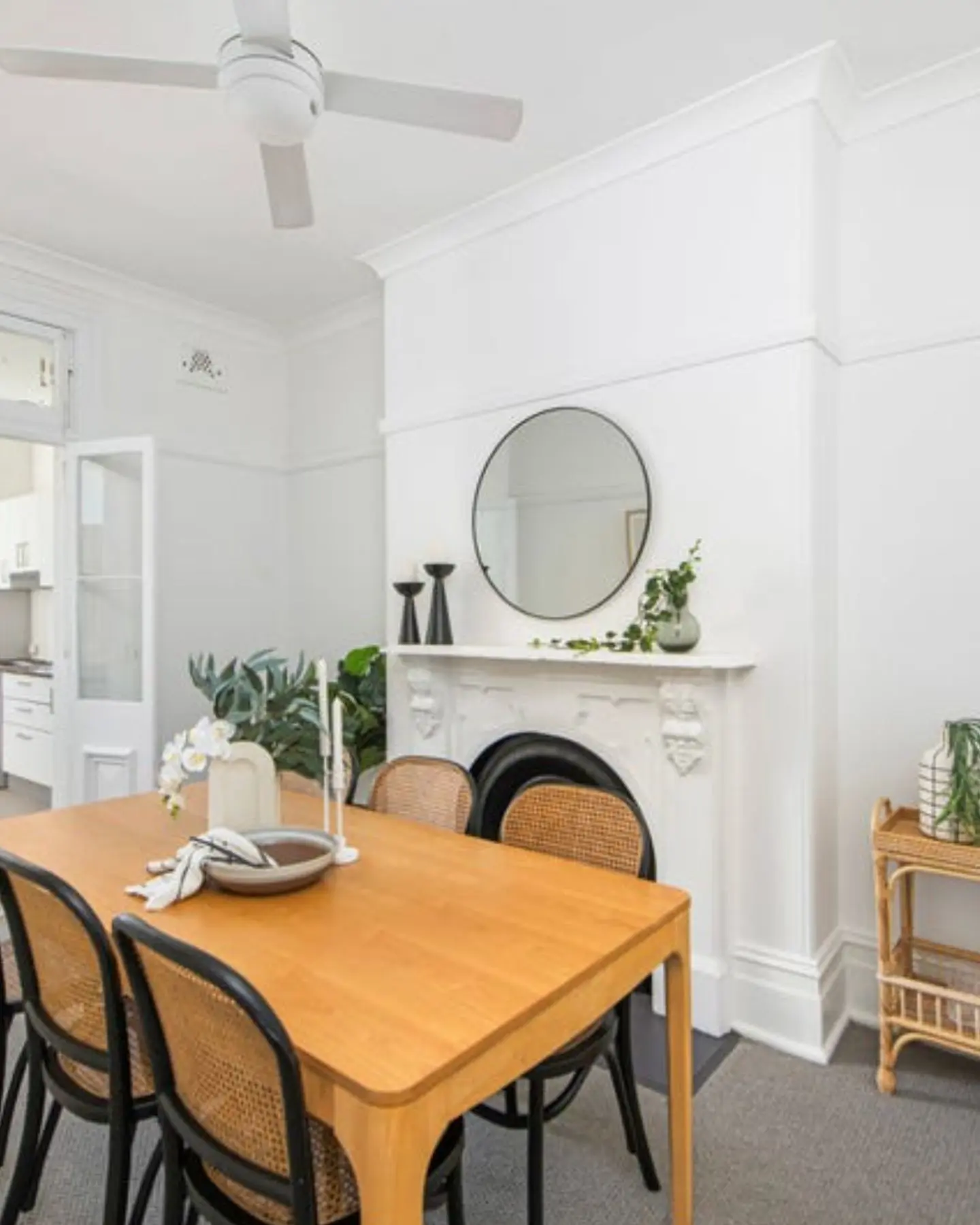 beautifully renovated dining area with a classic fireplace and modern styling, showing our interest in purchasing character homes with contemporary updates on the North Shore