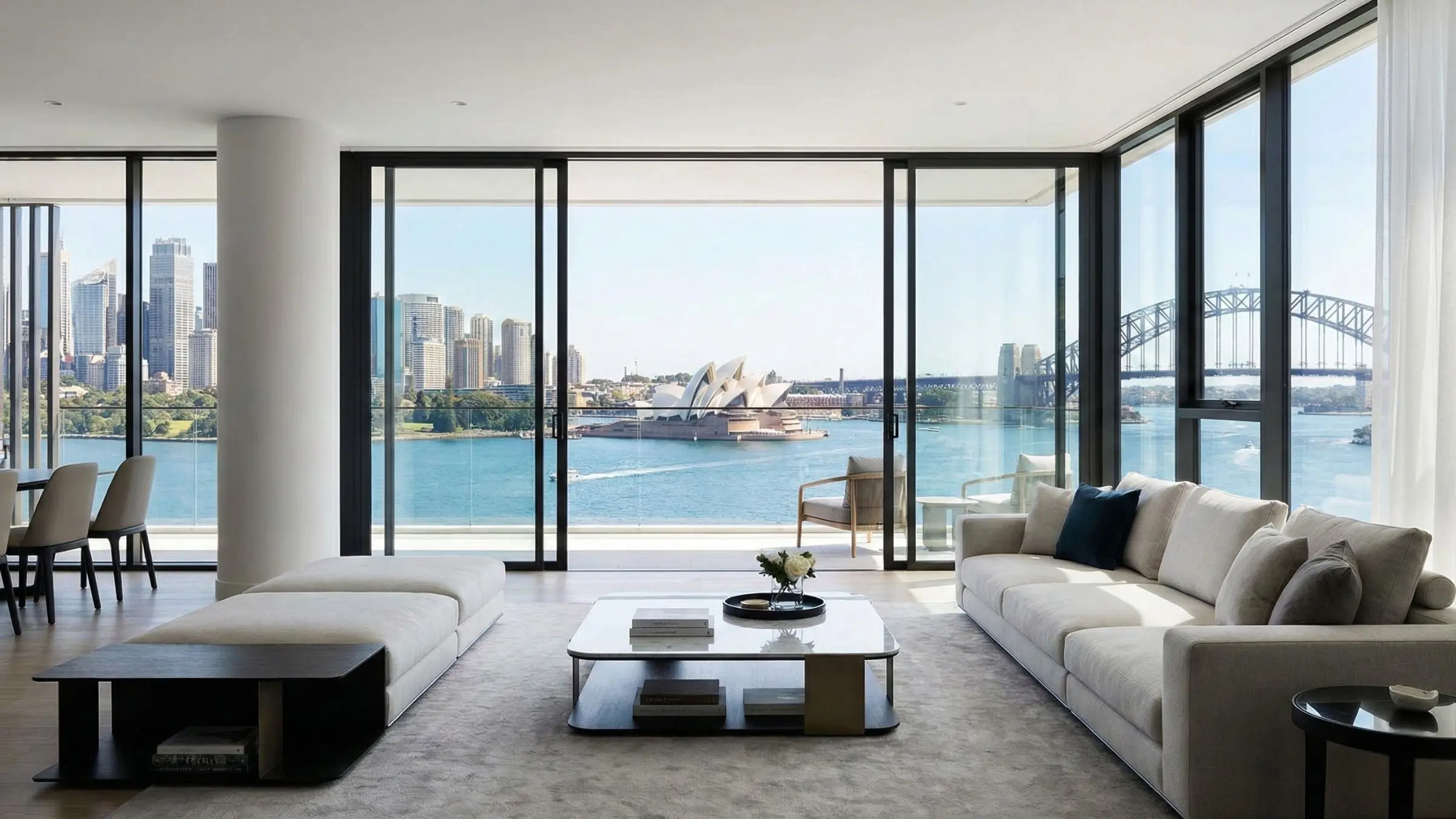 Modern luxury apartment interior with floor-to-ceiling glass and water views, typical of the downsizing options in Neutral Bay and Cremorne