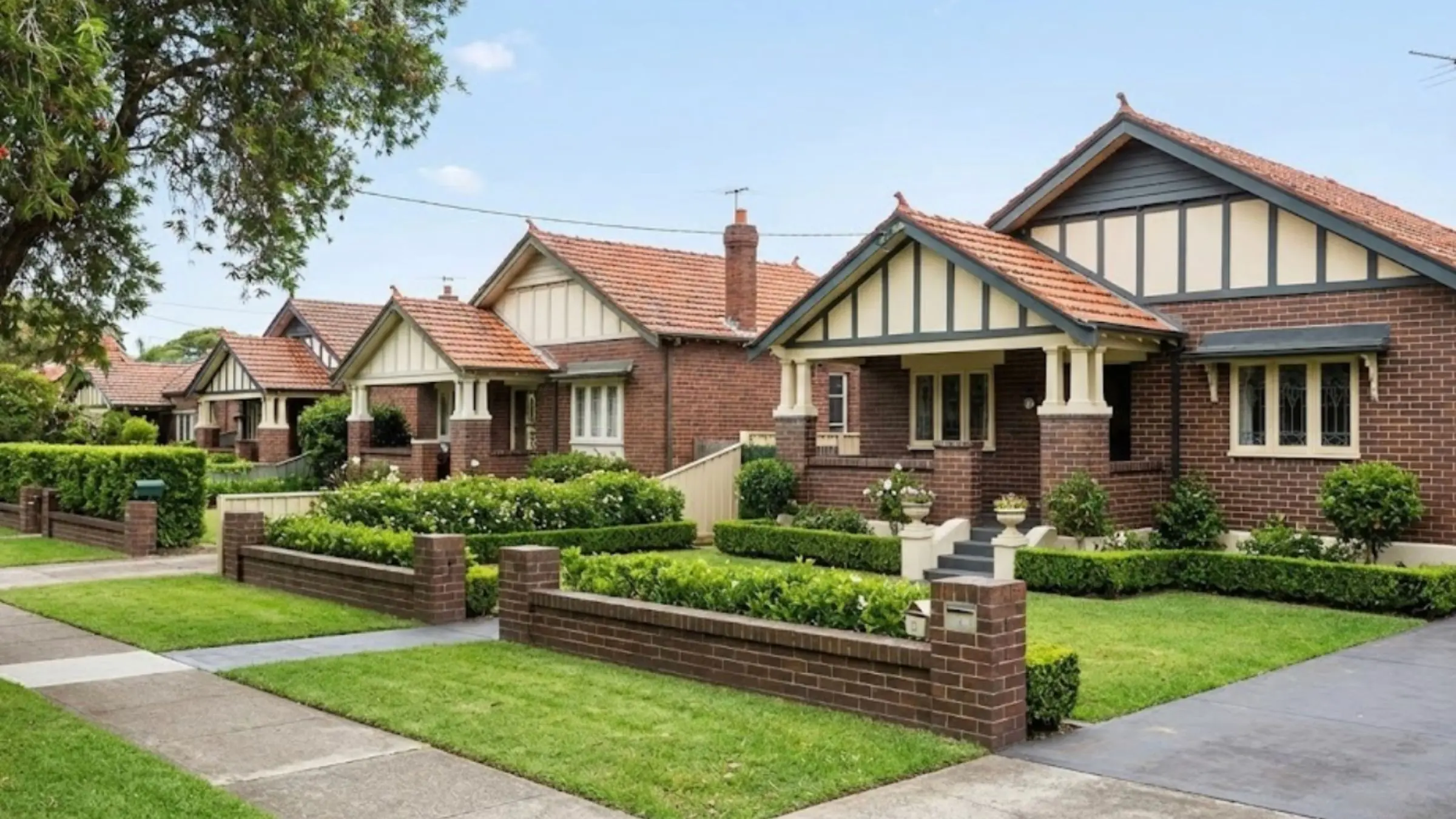 A picturesque residential street in Roseville featuring a row of beautifully restored California bungalow homes with well-maintained gardens