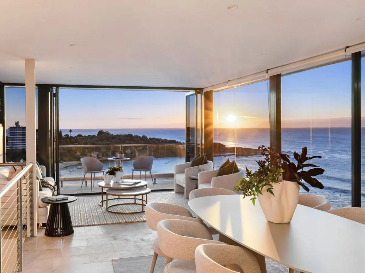 Living room and terrace with ocean views at sunrise in a house on Crown Road, Queenscliff, bought for a client the day before auction