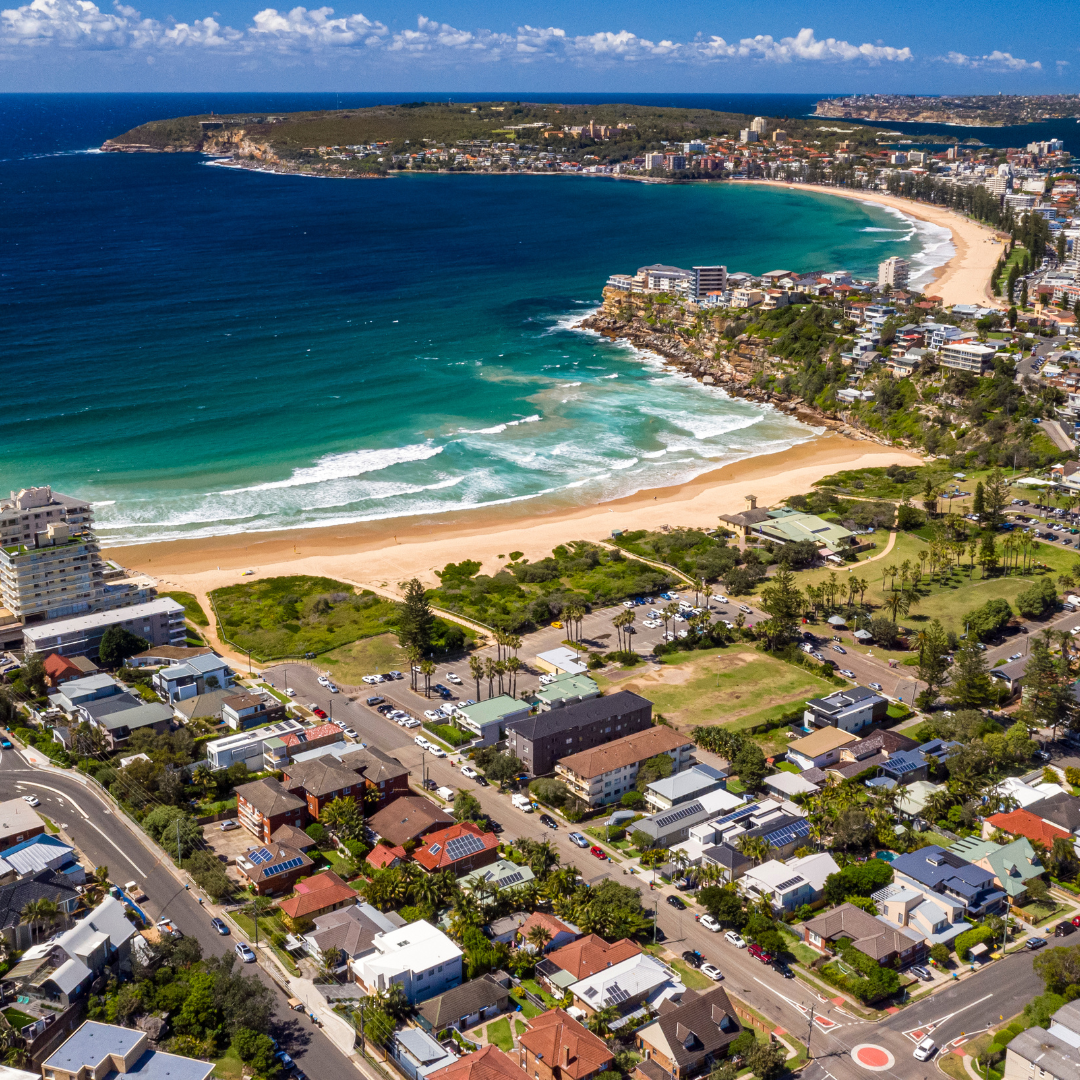 Aerial sunset view of Freshwater homes and headland – premium location in the Freshwater property market