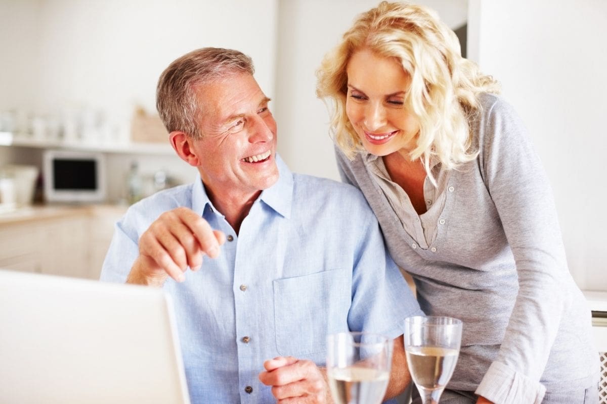 Happy mature couple relaxing, trusted outcomes with Northern Beaches buyers agent guidance.